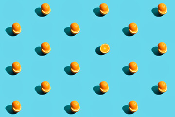 Repetitive pattern made with orange on blue background.