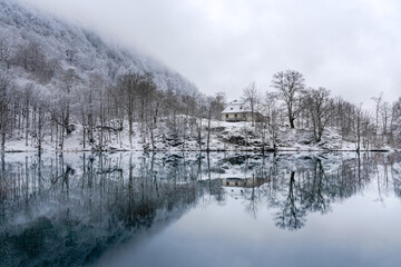 Mountain refuge at the Lac de Bethmale during winter in Ariege, France