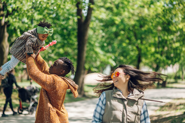 Multiracial family having fun in the park