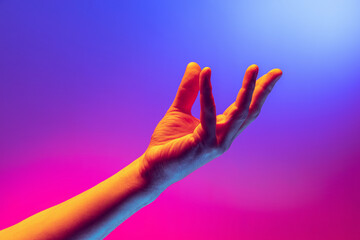 Human hand gesturing isolated on gradient purple-pink background in neon light. Concept of sign language, creativity, symbolism, culture and art - obrazy, fototapety, plakaty