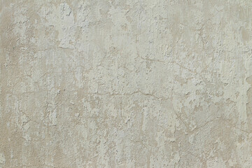 The texture of the cracked wall of the house. Chalk paint peeled off the wall.