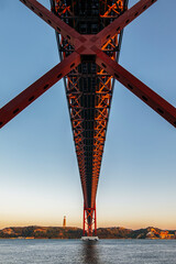 Lisbon landscape at sunset. Photography under the 25 de Abril bridge in the city of Lisbon over the Tagus river, Portugal