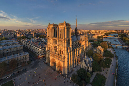 Panoramic aerial view of Notre Dame Basilica at sunset in Paris, France.