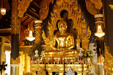 Golden buddha sitting in the church