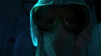 Close-up of mannequin in protective suit. Stock footage. Creepy eyes of mannequin are visible in protective glasses and mask. Equipment from virus or chemical attack on mannequin