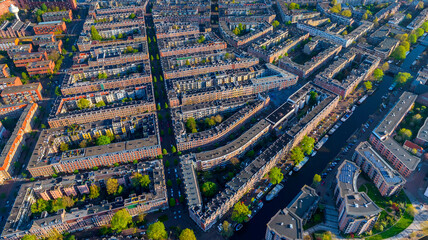 Panoramic aerial view of colourful buildings in Amsterdam west district among the canals, The Netherlands.