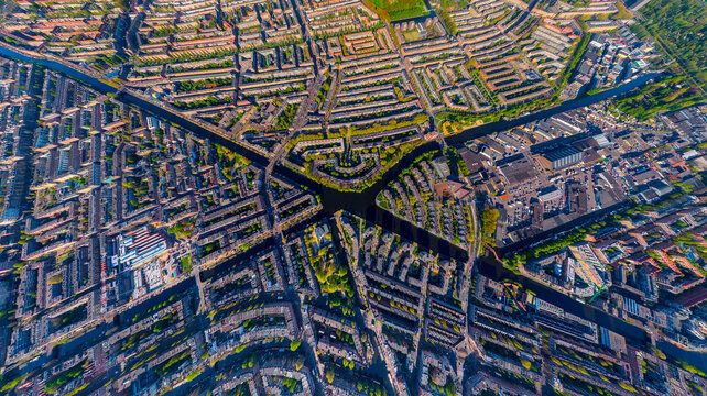 Panoramic aerial view of colourful buildings in Amsterdam west district among the canals, The Netherlands.