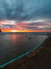 Fototapeta na wymiar Colorful dawn view of Bilgola Beach rock pool, Sydney, Australia.