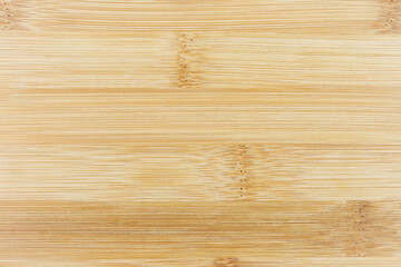 The texture of the smooth lacquered surface of the wood.
