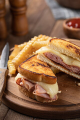 Grilled ham and cheese sandwich and french fries