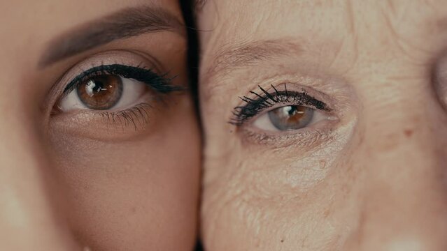 Eyes of old and young woman