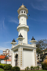 A minaret of the ancient Kapitan Keling mosque in the heritage city of George Town in Penang.