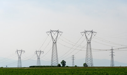 High voltage power lines, high voltage electrical transmission towers, copy space