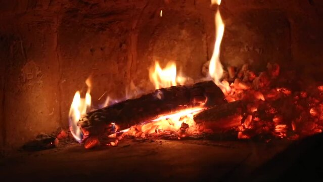 Slow burning wood in the fireplace. Autumn and winter holidays. Home comfort.