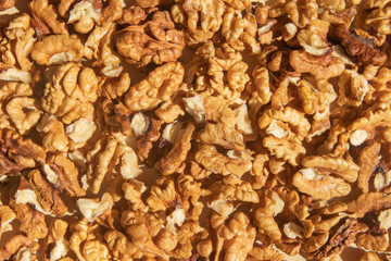 Peeled walnuts top view. Food abstract background with nuts