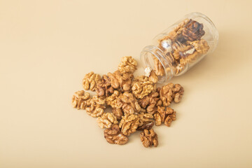 Jar of peeled halves of walnuts top view