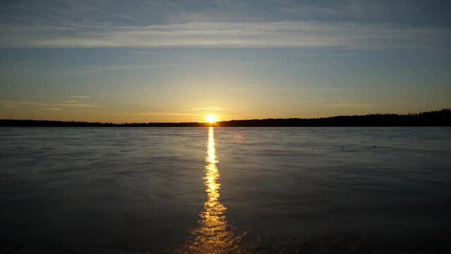 Beautiful time lapse of sunset over the lake