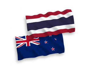 National vector fabric wave flags of New Zealand and Thailand isolated on white background. 1 to 2 proportion.