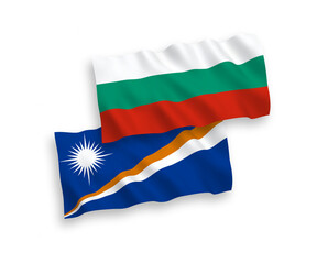 National vector fabric wave flags of Bulgaria and Republic of the Marshall Islands isolated on white background. 1 to 2 proportion.