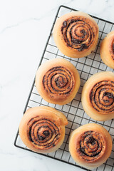 Round buns with poppy seeds