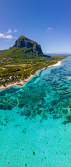 Le Morne beach Mauritius Tropical beach with palm trees and white sand blue ocean and beach beds...
