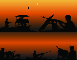 Fototapeta na wymiar the silhouette of soldiers holding guns guard the border