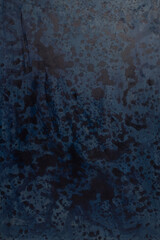 Dark spots on blue background