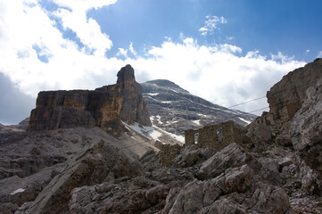 Lansdcape photo of the in the Italian alps (Dolomites). The image shows the remnants of old World War One fortifications. In the background high above the peak of Tofana di Rozes. 
