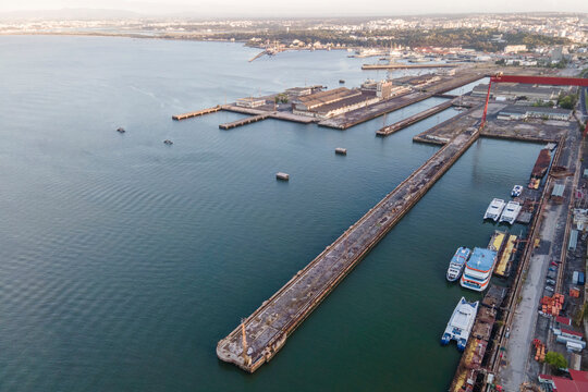 Aerial view of a Naval warf in Cacilhas township at sunset along Tagus river, Almada, Lisbon, Portugal.