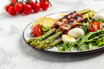 Bacon wrapped asparagus. Healthy diet food for Keto breakfast. Long banner format, top view