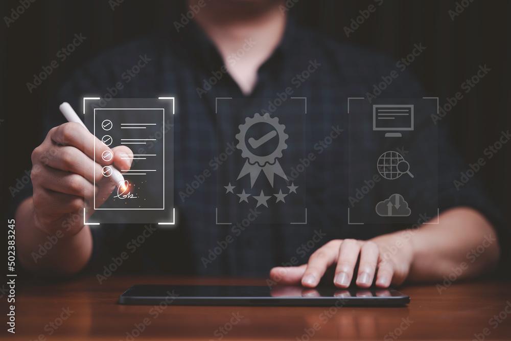 Poster Hand using electronic for signature to document on  virtual screen and document for online approve paperless quality assurance and ERP management concept.