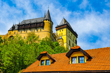 Fototapeta premium Karlštejn castle, a large Gothic castle founded in 1348 by Charles IV, Holy Roman Emperor, is one of the most famous and most frequently visited castles in the Czech Republic