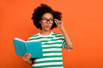 Portrait of attractive funny intellectual wavy-haired girl reading plan touch specs pout lips...