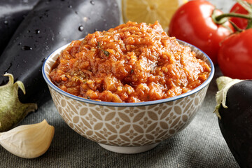 Eggplant and tomato salad Zaalouk dish in bowl. Homemade cooked vegetable salad from Moroccan cuisine.