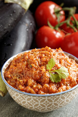 Eggplant and tomato salad Zaalouk dish in bowl. Homemade cooked vegetable salad from Moroccan cuisine.
