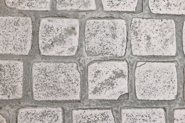 Weathered gray pavement on street
