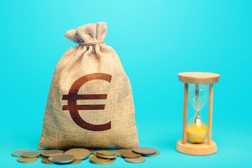 Euro money bag and hourglass. Profitability and return on investment. Time for paying taxes....