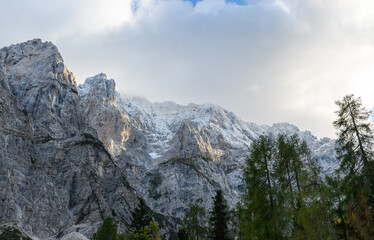 Magnificent snowy mountain, and trees beneath in the Julian Alps in Slovenia