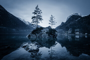 Grayscale shot of the Hintersee, Mountain Lake, Stones in Water, Bavaria, Germany