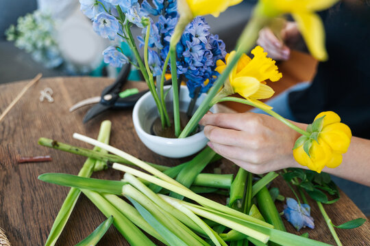 Anonymous Woman Creating Japanese Flower Arrangement