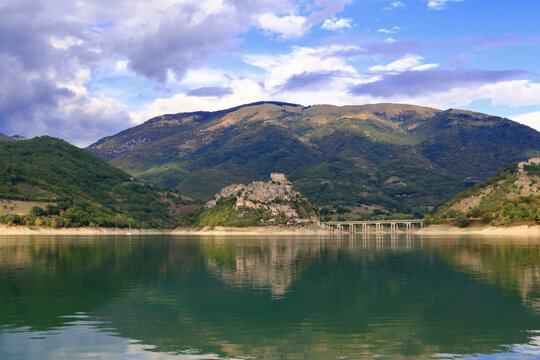 Scenic view of a town lake with mountains in the background, Nature Reserve, Varco, Italy