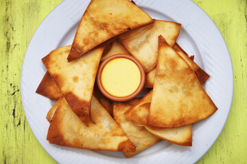 Selective focus shot of tasty, homemade chips served with mayonnaise