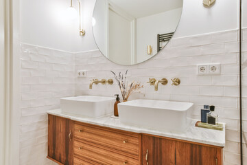Sinks near mirror in bathroom