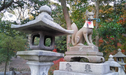 Fox Statue, Sitting Next to the Japanese Stone Lantern