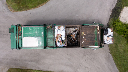 Top view shot of a garbage truck on a sunny day in Florida