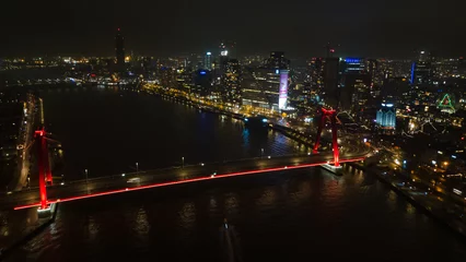Poster Luchtfoto van een verlichte brug in het moderne Rotterdam © Dc Photography/Wirestock Creators