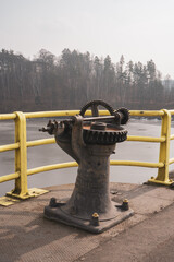 Closeup of a mechanical device in the parking area of Pilchowice Dam on the Bobr River in Poland © Mateusz8/Wirestock Creators