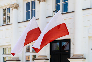 State red and white flag of Poland on the facade of a government building