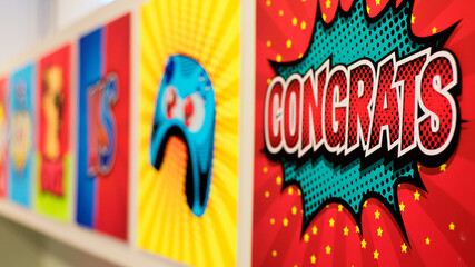 Selective focus of the word congrats in pop art style