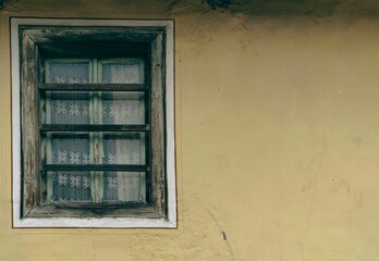 Old wooden window with curtains,old house